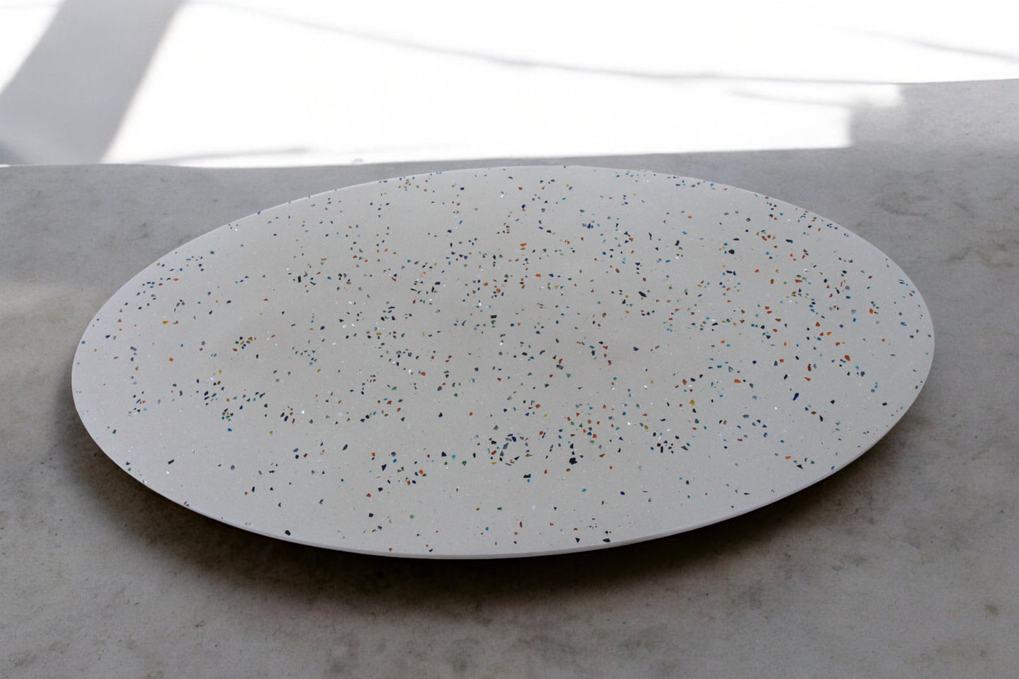 Round Concrete Table with White Surface and Glass Shard Mix